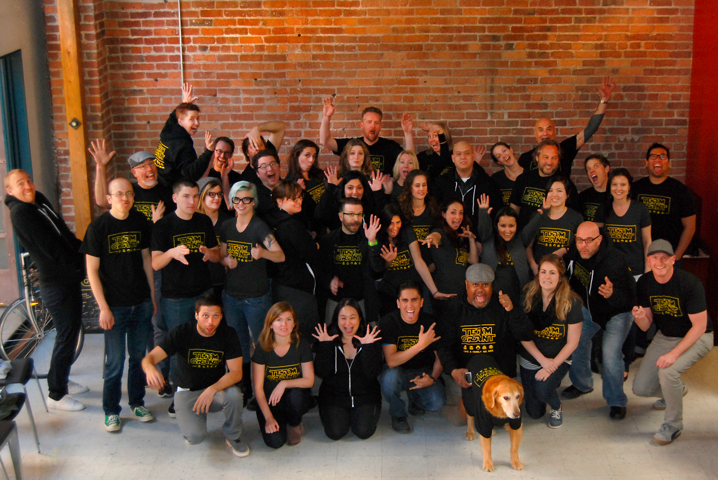 Traction team photo where everyone is wearing a t-shirt with "Team Grant" on it
