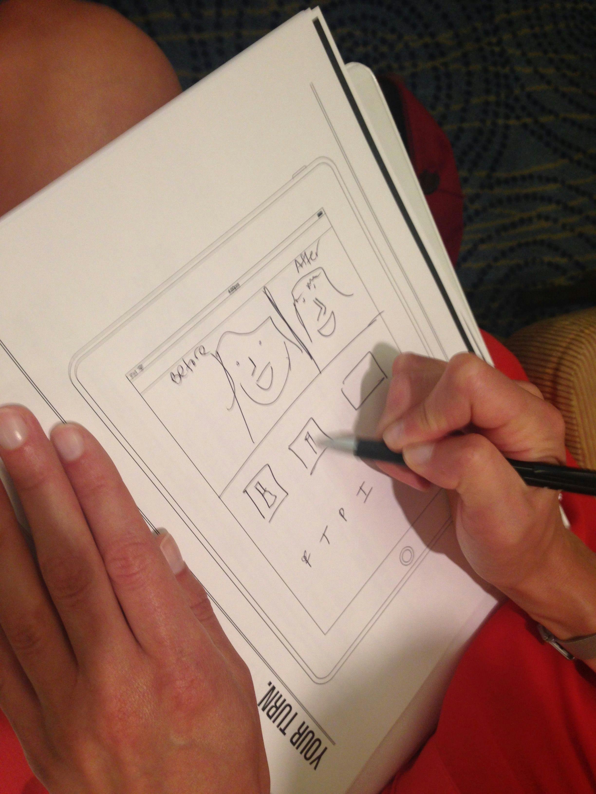 Woman drawing UX concept sketch